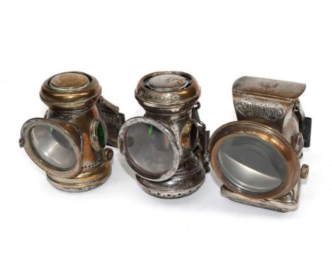 Three Early 20th Century Lamps, comprising a Lucas cap number 320 nickel plated lamp with magnifying lamp and green/red side 
