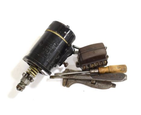 AN Austin 7 6 Volt Starter; A 6 Volt Voltage Regulator; Two Wooden-Handled Slot-Headed Screwdrivers; and An Adjustable Spanne