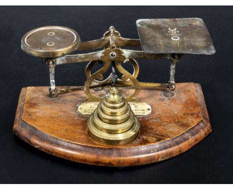 A small set of letter weigh scales and brass weights