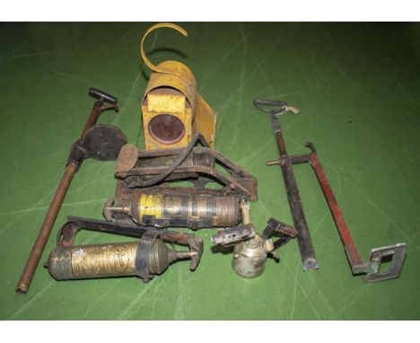 Vintage foot pump, two fire extinguishers and two hand pumps and a road works lamp