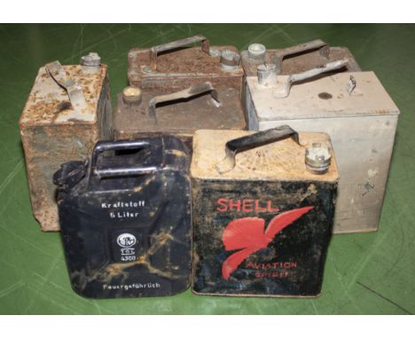 Seven assorted vintage petrol cans