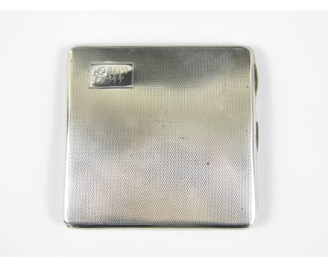 A George VI silver cigarette case, bearing engine-turned decoration and cartouche with engraved monogram ESW, Birmingham, 193