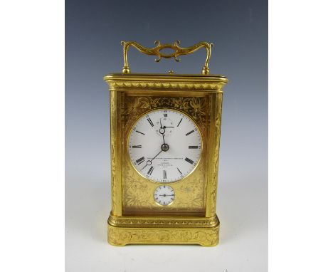 A mid 19th Century carriage repeater alarm clock  by Bourdin of Paris, having circular enamel face with Roman numerals, subsi