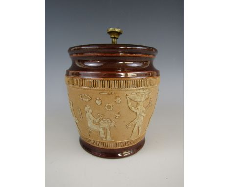 A Royal Doulton salt glazed stoneware tobacco jar, with sprigged decoration in the form of Egyptian figures, impressed marks,