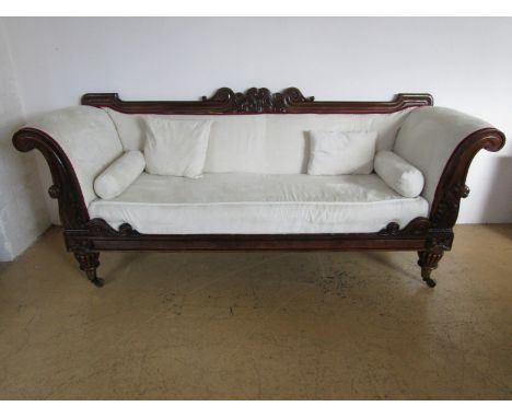 A George IV upholstered rosewood sofa, having straight back with acanthus and scroll crest, conforming facings to the scroll 