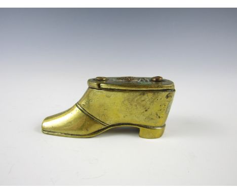 A Victorian brass snuff box modelled as a gentleman's shoe and bearing a Royal Engineers badge