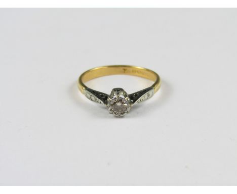 A vintage diamond solitaire ring, the brilliant of approximately .2 ct claw-set in precious white metal on a 22 ct gold cheni