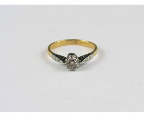 A vintage diamond solitaire ring, the brilliant of approximately .2 ct claw-set in precious white metal on a 22 ct gold cheni