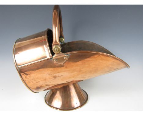A Victorian copper coal helmet