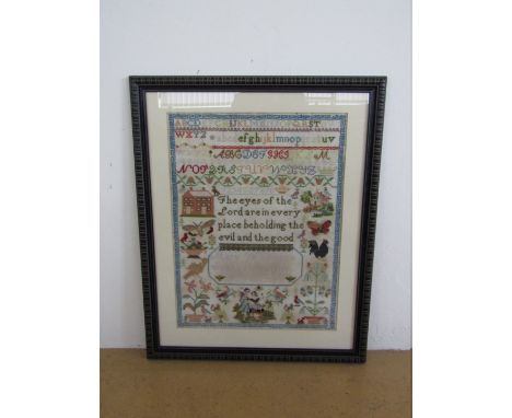 A Victorian needlework sampler worked by Mary Wilkinson in her 14th year, 1877, in wool threads over aida, with central verse