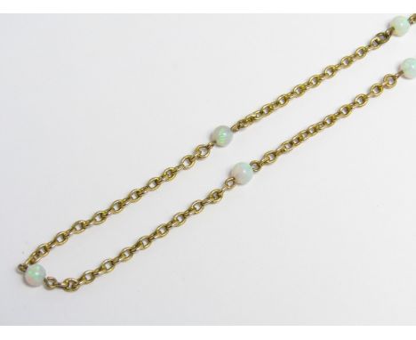 A vintage opal necklace of spherical beads interspersed on a fine 9 ct gold belcher link neck chain, beads 4 mm diameter, 44 