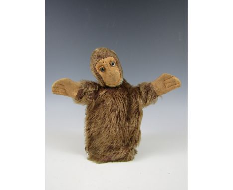 A Farnell's Alpha Toys monkey glove puppet, in brown mohair, with pink felt face and ears, and glass eyes, 21 cm 