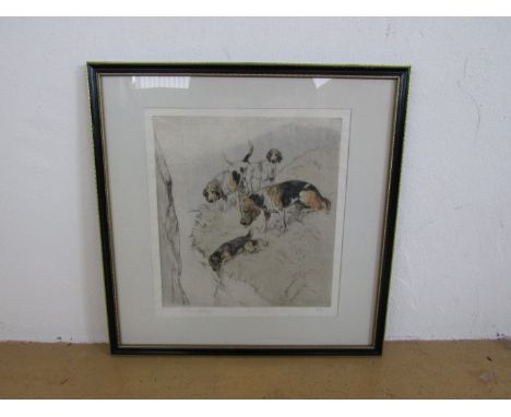 George Vernon Stokes (1873-1954) Characterful study of four dogs intrigued by the cleft of a mountain, with Border Terrier cr