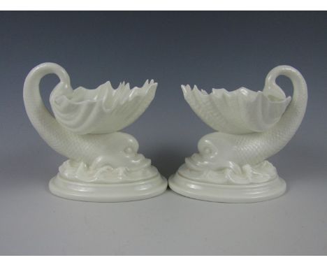 A pair of Royal Worcester table salts modelled as dolphins, 20th Century, 12 cm high