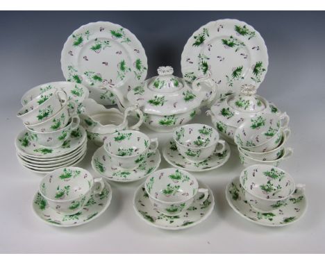 A Victorian tea service, hand enamelled in a green and purple stylised floral pattern, (a/f)