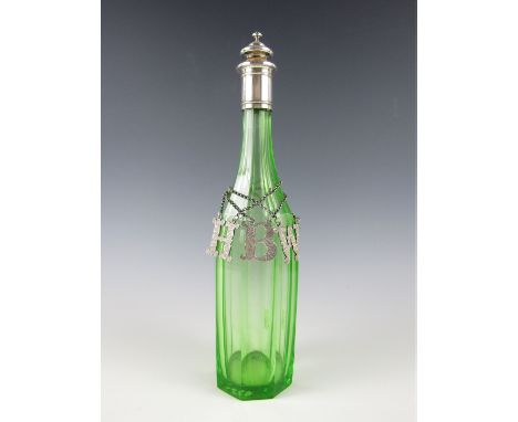 A Victorian green glass decanter of polygonal section, with electroplate collar and stopper mount, together with three Victor