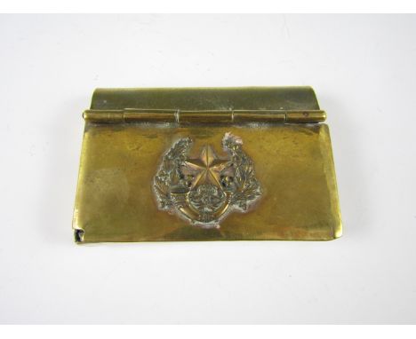 A late 19th / early 20th Century brass book-form snuff box bearing a badge of the Cameronians