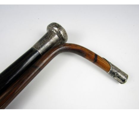 A late 19th / early 20th Century ebony walking cane with silver pommel, J Howell & Co, Birmingham, (mark partly struck), 89 c