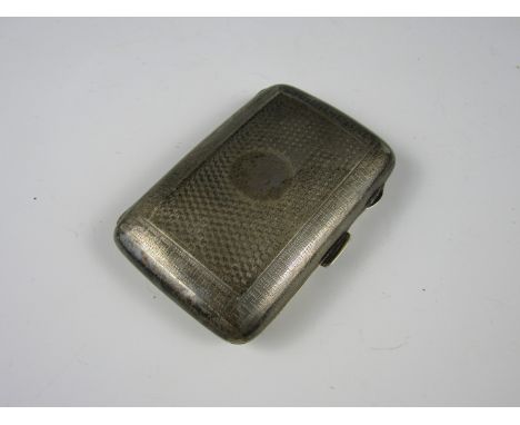 A George V silver cigarette case, of subtly convex cushion form, bearing geometric engine turned decoration, Birmingham, 1923