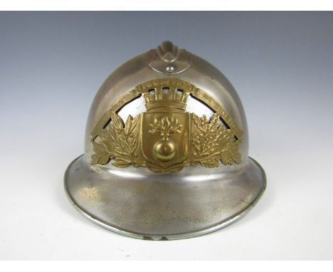 An early 20th Century French Sapeurs Pompiers de Saint Frere helmet