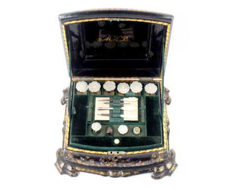 A personalised Victorian papier mache sewing box, circa 1850, of bombe form with curved front raised on a moulded plinth base