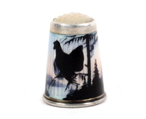 A Norwegian silver and enamel moonstone top thimble by David Anderson, depicting a tiur or grouse resting on a branch in a pi