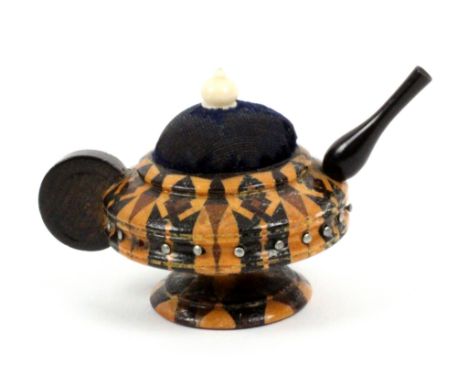 A Tunbridge ware teapot pin cushion, in stick ware with rosewood spout and handle, the body incorporating a pin wheel, 7cms w