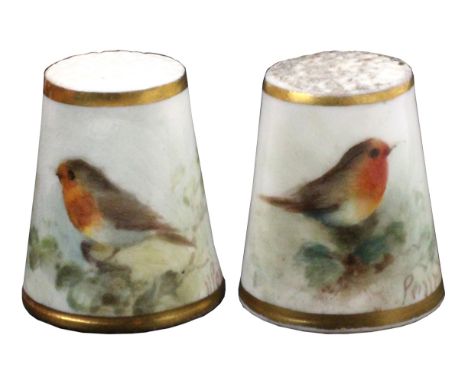Two Royal Worcester painted porcelain thimbles, both by William Powell, both depicting a robin amid foliage between gilt line