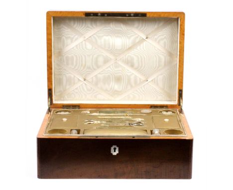 A well fitted continental figured mahogany steel mounted sewing box, circa 1840, the lid with large cut steel carrying handle
