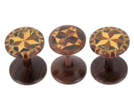 Tunbridge ware, sewing, three rosewood reels, with stick ware tops, comprising a pair and a single, the pair 3cms dia., 3.2cm