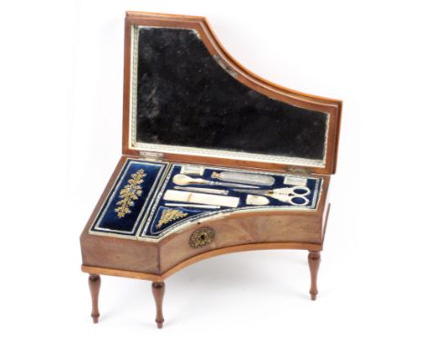 A Palais Royal musical mahogany sewing box, circa 1830, raised on five turned legs with pressed brass oval shell and scroll e