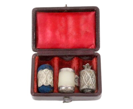 An English leather cased silver sewing trio, circa 1830, the rectangular maroon leather case with swivel catch, the interior 