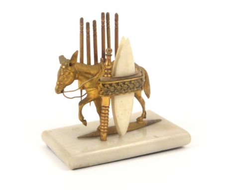 A scarce gilt metal donkey sewing companion, circa 1860, mounted on rectangular alabaster base, the donkey pannier fitted wit