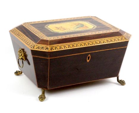 A fine fitted coromandel wood paint and print decorated Tunbridge ware sewing box, of sarcophagol form raised on brass paw fe