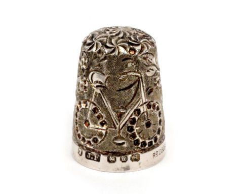 A rare silver bicycle thimble by James Fenton, blackberry ground, gentleman's bicycle with dotted tyres, Birmingham 1896 with