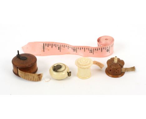 Five tape measures, comprising a bone bun form example with complete printed tape in ins., coffee grinder brass handle, 2.8cm