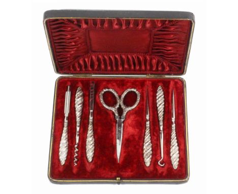 A set of seven silver mounted sewing and manicure tools in leather case, 1880, the black leather case with tooled decoration,