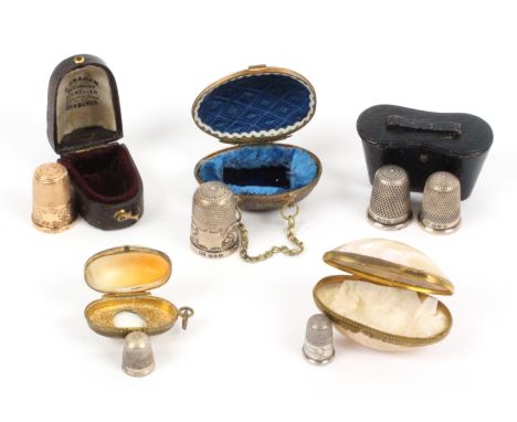 A group of cased thimbles, comprising a gold thimble by Henry Griffiths and Sons in leather case, two silver thimbles in a gr