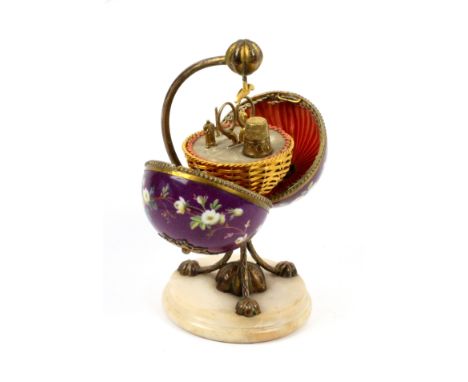 A French sewing etui for a child, circa 1850, the circular alabaster base mounted with a brass tripod form base and curved ar