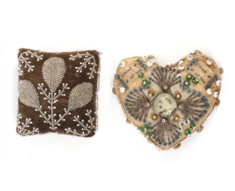 Two large format pin cushions, comprising a bead and pin stuck example with central circular portrait of Edward VII, 14cms, a