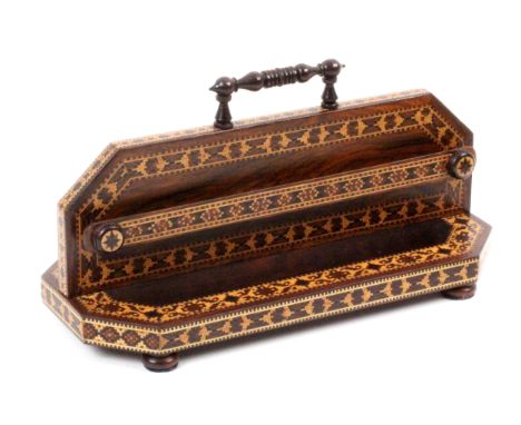 An attractive Tunbridge ware rosewood letter rack, the cut corner rectangular base raised on rosewood bun feet, the central c