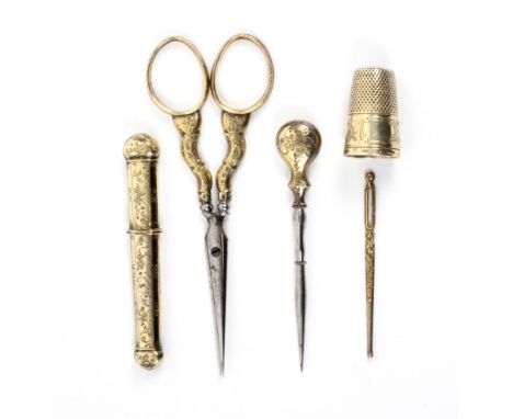 An attractive set of five French silver gilt engraved sewing tools, comprising a pair of oval section steel bladed scissors w