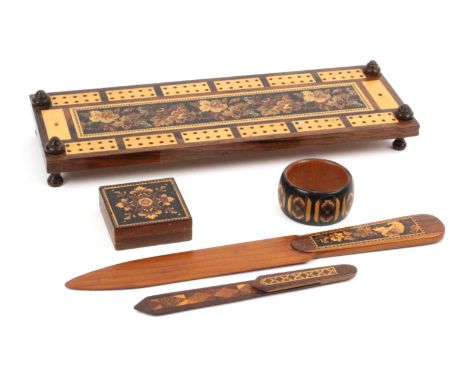 Tunbridge ware - five pieces, comprising a rectangular cribbage board with floral mosaic panel and raised turned feet, 25.8cm