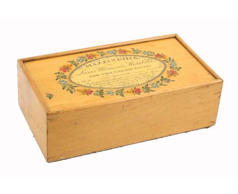 A rare white wood paint and print decorated Tunbridge ware box advertising 'Mazzinghis Lusus Harmonia Mutabilis …..', (change