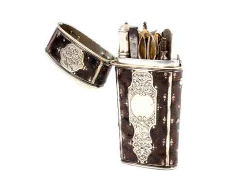 A late 18th Century silver and leather travelling etui, unmarked, of oval section and tapering form, the body with engraved s