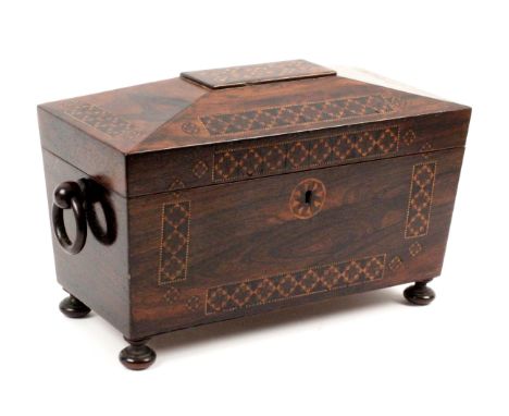 A rosewood Tunbridge ware tea caddy, of sarcophagol form the lid and front with rectangular and circular panel of stick ware,