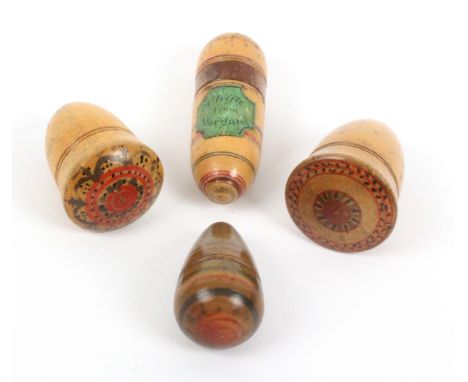 Four white wood paint decorated Tunbridge ware thimble cases, comprising an elongated acorn form example with black on green 