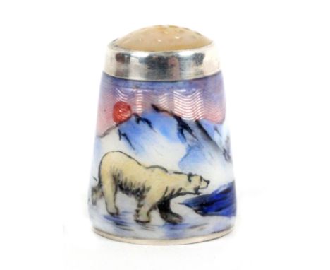 A Norwegian silver and enamel moonstone top thimble by Aksel Holmsen, depicting a polar bear by water in a snowy mountainous 