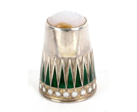 A Norwegian silver and enamel moonstone top thimble by Marius Hammer, in the peaks and dot pattern, green and white, internal