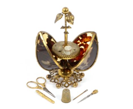 A French etui for a child, circa 1890, the gilt metal pierced leaf and ball base supporting a gilt metal framework incorporat